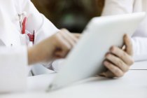 Doctor using digital tablet, close-up — Stock Photo