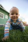 Baby boy crawling in garden — Stock Photo