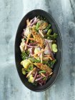 Peppered mackerel, kale, carrots, broad beans, green beans — Stock Photo