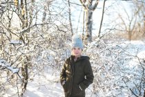 Portrait of young girl in snowy landscape — Stock Photo