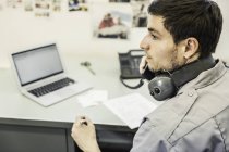 Scientist using landline in plant growth research facility office — Stock Photo