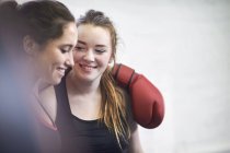 Two young female boxing friends in gym — Stock Photo