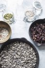 Still life with sunflower seeds, cranberries and pumpkin seeds — Stock Photo