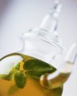 Mint tea in glass teapot, close up shot — Stock Photo