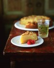 Slice of almond polenta cake with raspberries — Stock Photo