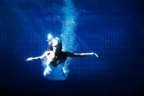 Woman in white dress underwater — Stock Photo