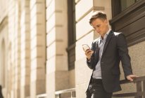 Businessman using phone, London, UK — Stock Photo