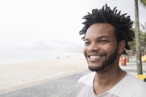 Portrait of mid adult man on Ipanema beach, Rio De Janeiro, Brazil — Stock Photo