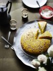 Lebanese sponge cake with cedar seeds on table — Stock Photo