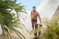 Man by poolside, selective focus — Stock Photo