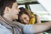 Young couple driving car laughing, Cape Town, Western Cape, South Africa — Stock Photo
