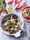 Sauteed mushrooms with basil pesto in dish, top view — Stock Photo