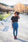 Portrait of stylish young woman in park — Stock Photo