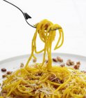 Forkful of spaghetti carbonara — Stock Photo