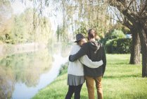 Young couple on riverbank, Dolo, Venice, Italy — Stock Photo