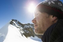 Close up portrait of hiker in snow covered mountains, Jungfrauchjoch, Grindelwald, Switzerland — Stock Photo