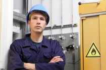 Portrait of confident male electrician in factory — Stock Photo