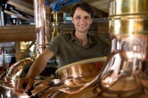Male brewer working in beer brewhouse — Stock Photo