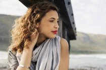Young woman daydreaming on coastal pier, Cape Town, Western Cape, South Africa — Stock Photo