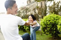 Tourist couple  laughing and dancing, The Bund, Shanghai, China — Stock Photo