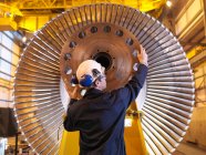 Engineer Inspecting Turbine at plant — Stock Photo