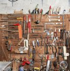 Interior of a workshop. Tools hang on a wall — Stock Photo