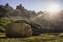 Boulder in sunlit mountain valley, Nahuel Huapi National Park, Rio Negro, Argentina — Stock Photo