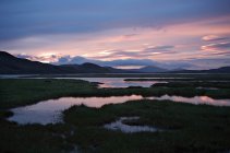 Beautiful sunset over majestic tranquil swampy landscape — Stock Photo