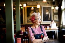 Quirky woman in bar and restaurant, Bournemouth, England — Stock Photo