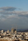 Cityscape view with Sagrada Familia and construction cranes, Barcelona, Spain — Stock Photo