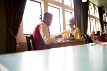 Quirky couple relaxing in bar and restaurant, Bournemouth, England — Stock Photo