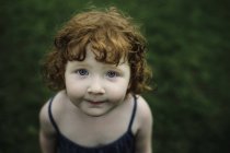 Portrait of toddler girl with red hair — Stock Photo