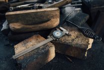 Blacksmith tools on workshop bench — Stock Photo
