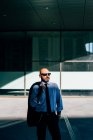 Portrait of mature businessman carrying suit jacket over shoulder — Stock Photo