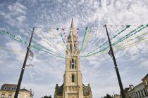 Low angle view of bunting from Eglise Notre-Dame bell tower, Bergerac, Aquitaine, France — Stock Photo