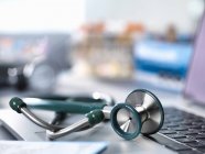 Close-up view of stethoscope on doctors desk in a clinic — Stock Photo