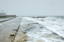 Sea waves covering pier concrete steps, Odessa, Ukraine, Europe — Stock Photo