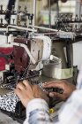 Person working on industrial smocking sewing machine in factory, Cape Town, South Africa — Stock Photo