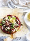 White bean, chorizo and octopus pizza, close-up — Stock Photo
