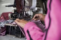 Seamstress working on industrial smocking sewing machine in factory, Cape Town, South Africa — Stock Photo