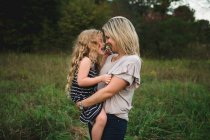Mother and daughter enjoying outdoors — Stock Photo