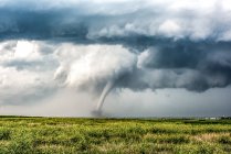 Tornado spinning towards town of Carpenter, Wyoming, USA — Stock Photo