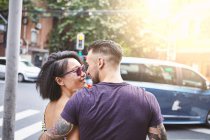 Multi ethnic hipster couple strolling along street, Shanghai French Concession, Shanghai, China — Stock Photo