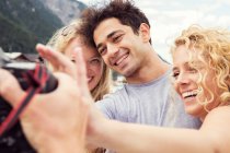 Smiling friends posing for photograph — Stock Photo