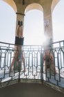 Two young men doing handstands on viewing platform, Lake Como, Lombardy, Italy — Stock Photo