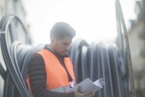 Portrait of road construction engineer with papers, Hannover, Germany — Stock Photo
