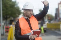 Road construction engineer with tablet device, Hannover, Germany — Stock Photo