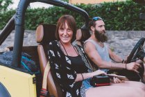 Portrait of young couple on road trip in off road vehicle, Como, Lombardy, Italy — Stock Photo