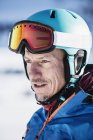 Portrait of skier in helmet and ski goggles — Stock Photo
