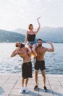 Portrait of three young friends posing at lake Como, Como, Lombardy, Italy — Stock Photo